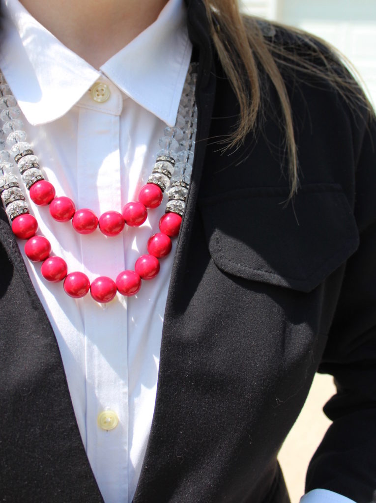 red statement necklace, white button-down, blazer