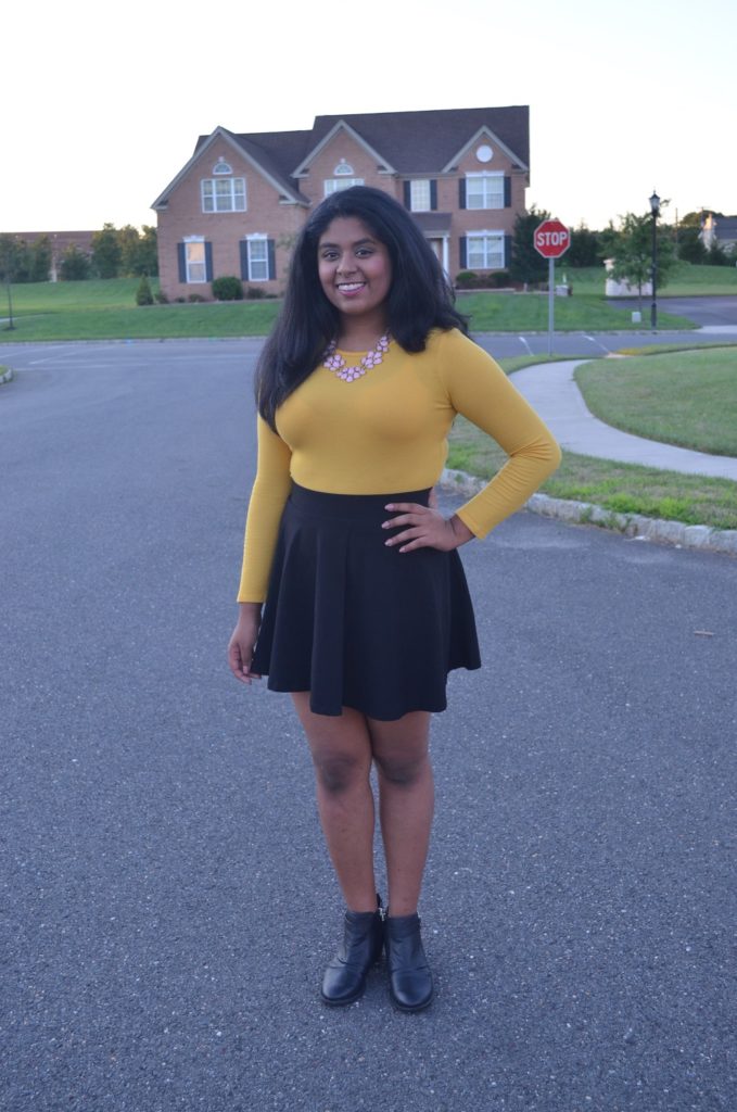 yellow top and black skirt