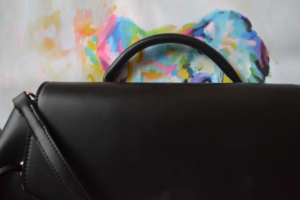 Black handbag with strap