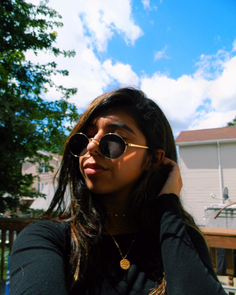 gold-rimmed oval sunglasses
