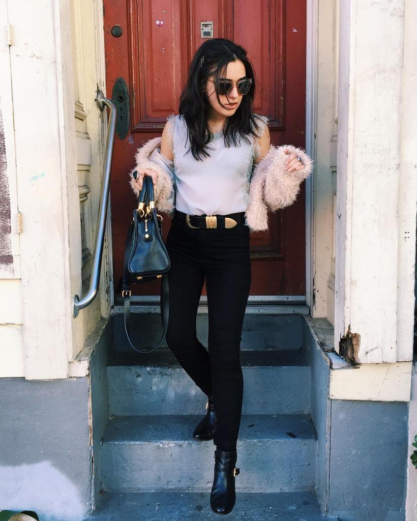 black jeans with a statement belt