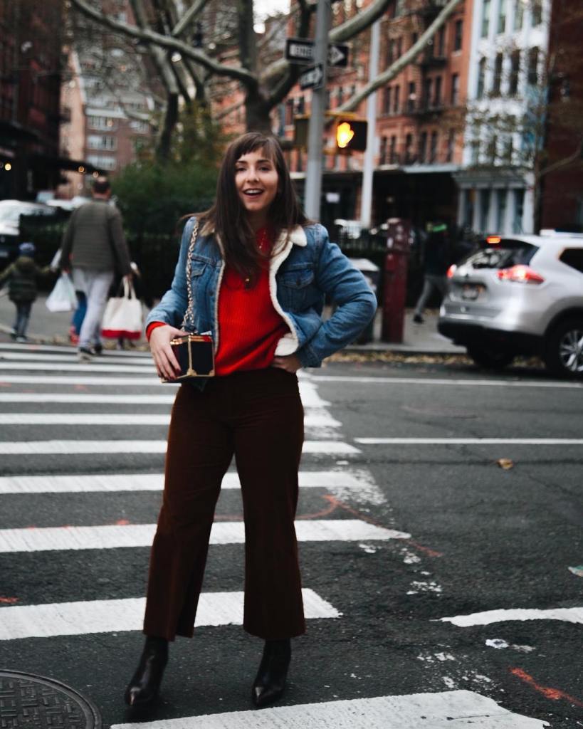 red sweater and denim jacket