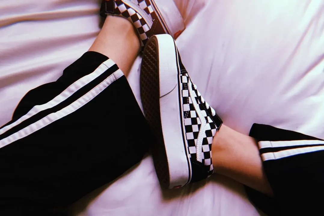 girl wearing checkered vans