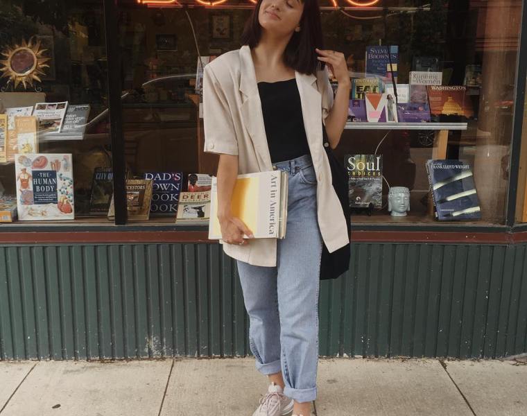 Girl standing in front of bookstore