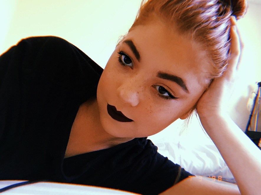 dark lips and winged liner look